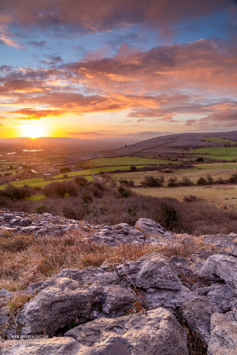 Abbey Hill Burren Clare Ireland - abbey hill,march,pink,rocks,sunrise,sunstar,winter,hills