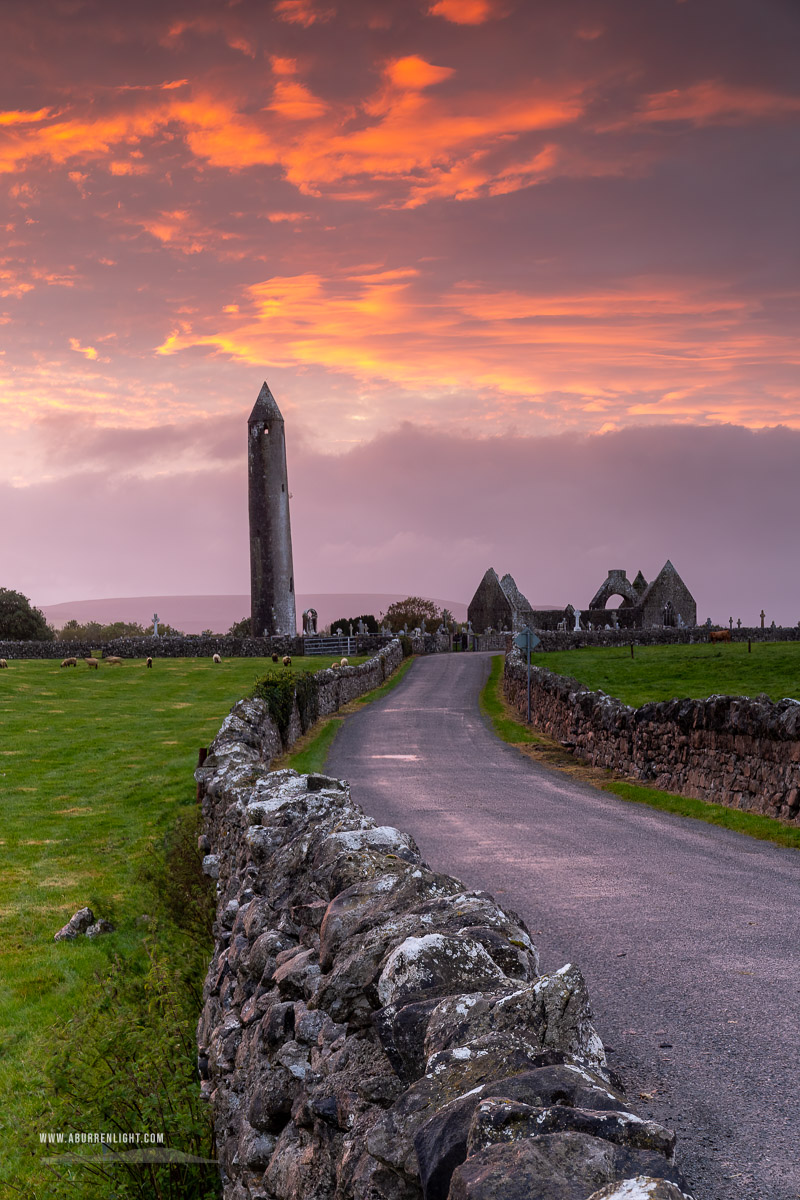 Kilmacduagh Monastery Burren Clare Ireland - church,gort,kilmacduagh,landmark,pink,september,summer,sunset,tower,portfolio,lowland