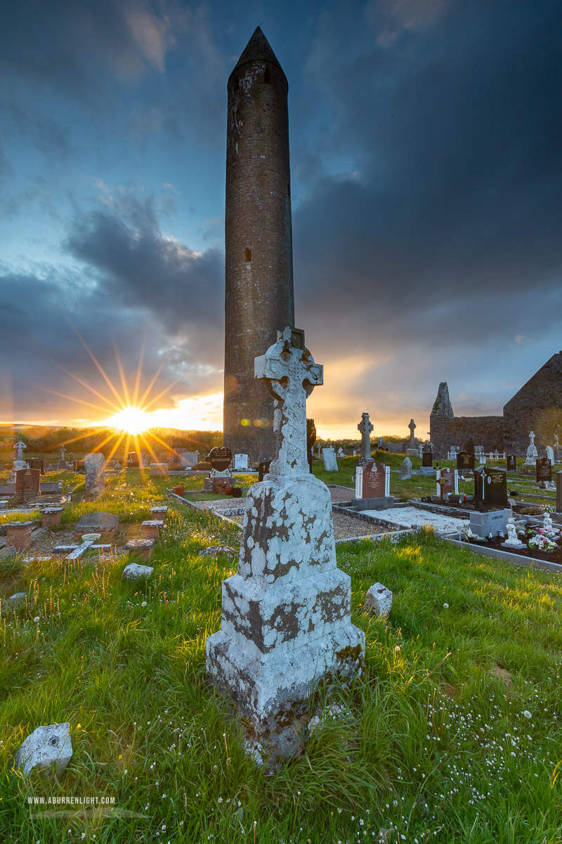 Kilmacduagh Monastery Burren Clare Ireland - grave,kilmacduagh,landmark,may,spring,sunset,sunstar,lowland,church,medieval,graves,cemetery