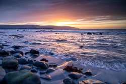 boulder,dusk,flaggy shore,golden,march,orange,sunset,winter,coast
